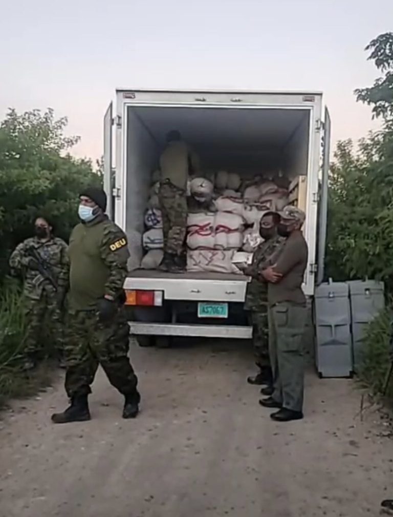 Seized drugs loaded into police vehicle